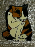 Cat Black and White and Brown licking its Paws Pin