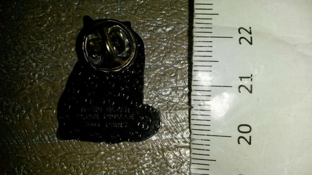 Cat Black and White and Brown licking its Paws Pin