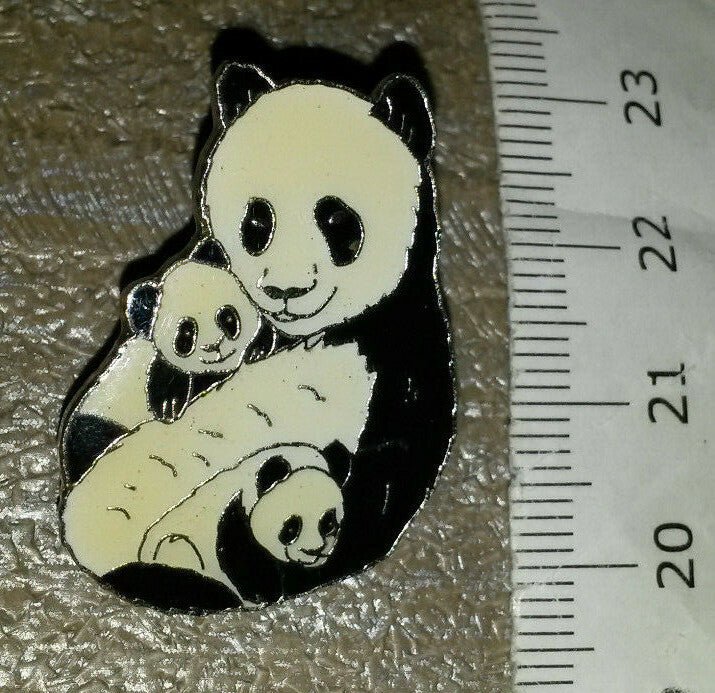 Panda Bear holding its babies baby Pin