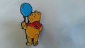 Winnie the Pooh holding a blue balloon European Disney Pin