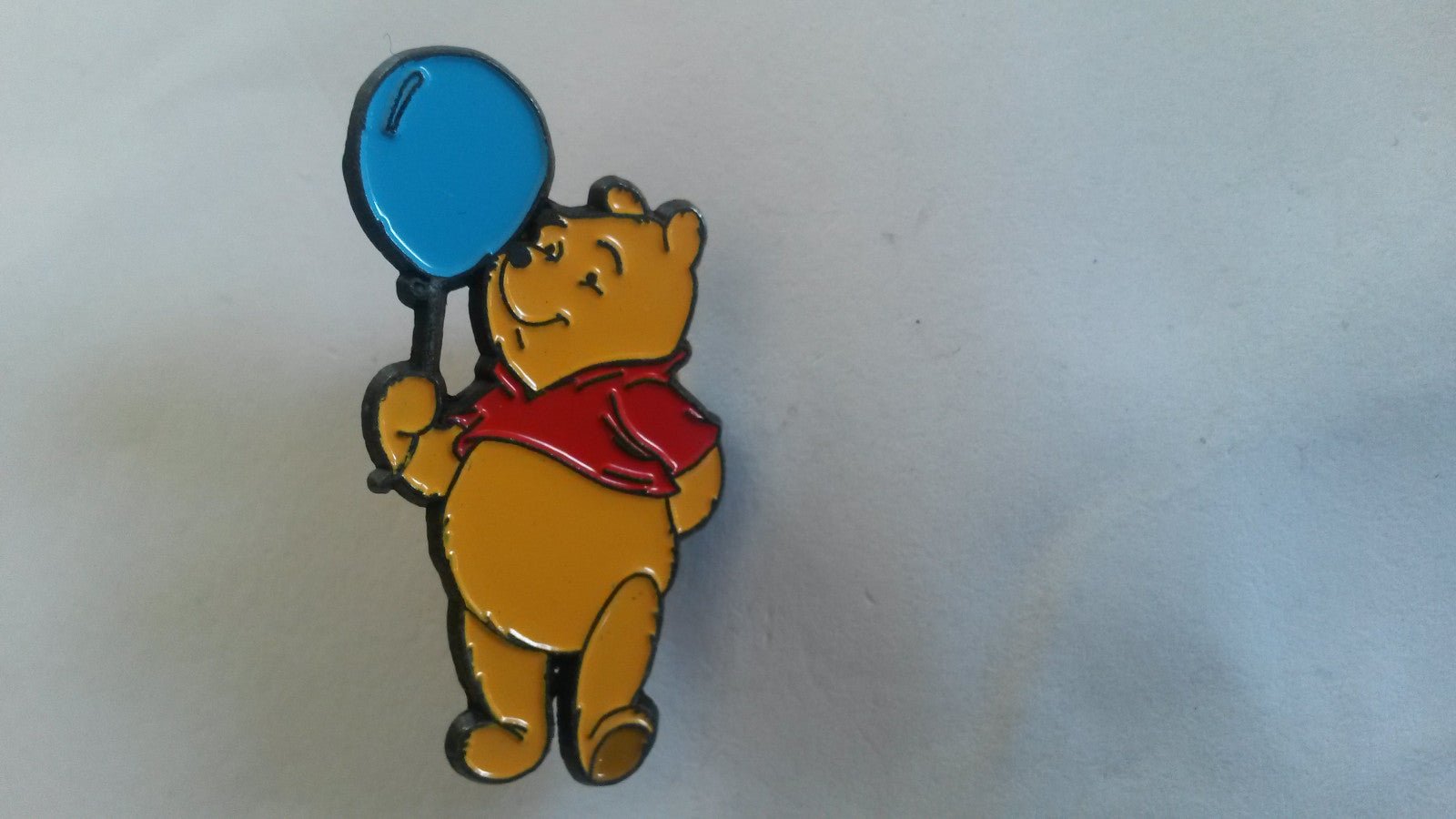 Winnie the Pooh holding a blue balloon European Disney Pin